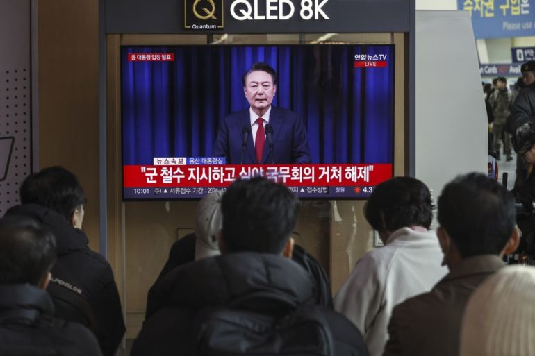 epa11761371 A TV screen shows a live broadcast of South Korean President Yoon Suk Yeol addressing the nation ahead of an impeachment vote, at a railway station in Seoul, South Korea, 07 December 2024. South Korean parliament is expected to hold an impeachment vote against President Yoon Suk Yeol after he declared and then reversed martial law, citing the need to root out pro-North Korean forces and uphold the constitutional order. EPA-EFE/JEON HEON-KYUN
