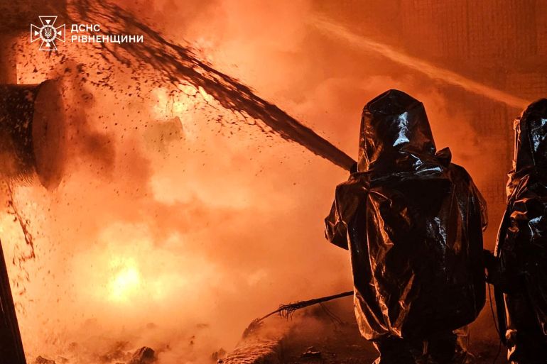 Firefighters work at the site of an energy infrastructure facility hit by a Russian drone strike, amid Russia's attack on Ukraine, in Rivne region, Ukraine December 3, 2024. Press service of the State Emergency Service of Ukraine in Rivne region/Handout via REUTERS ATTENTION EDITORS - THIS IMAGE HAS BEEN SUPPLIED BY A THIRD PARTY. DO NOT OBSCURE LOGO.