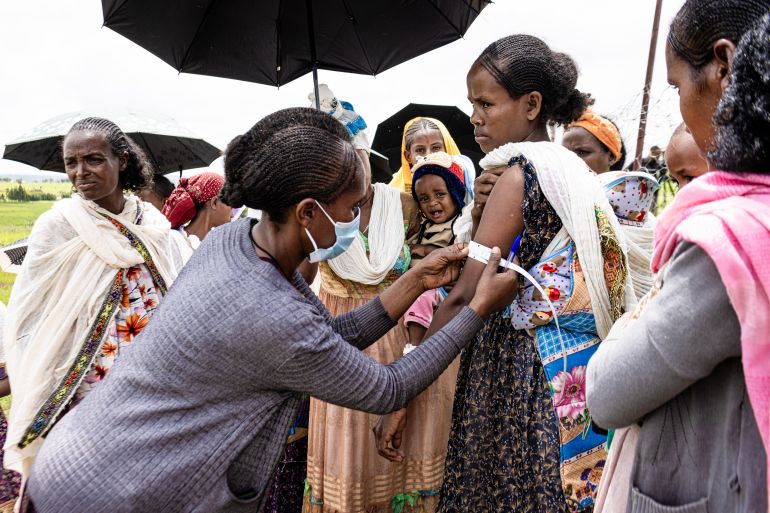 Doctor examining woman