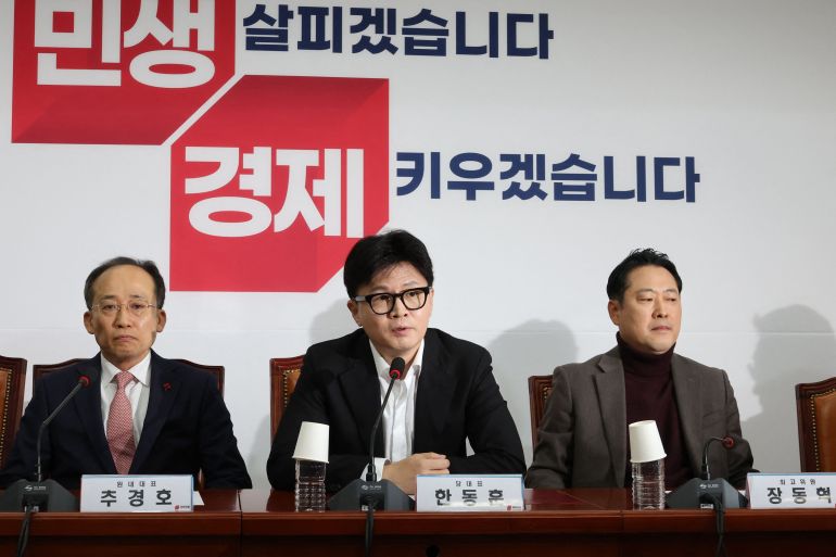 People Power Party's chief Han Dong-hoon (C) speaks