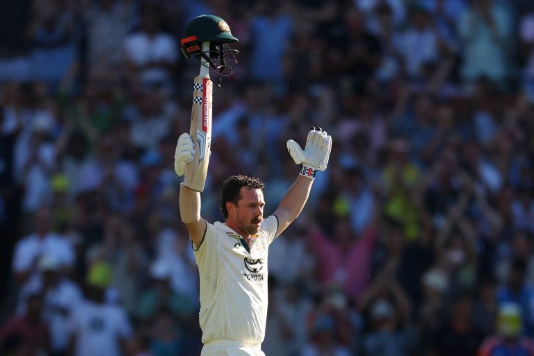 ADELAIDE, AUSTRALIA - DECEMBER 07: Travis Head of Australia raises his bat after scoring a century during day two of the Men's Test Match series between Australia and India at Adelaide Oval on December 07, 2024 in Adelaide, Australia. (Photo by Robert Cianflone/Getty Images)